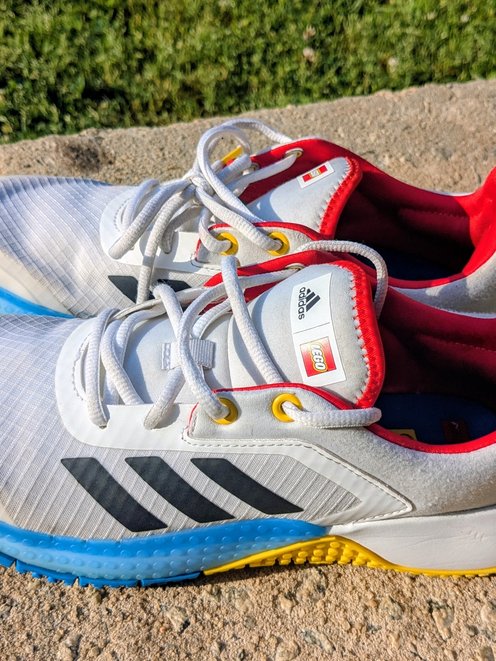 Adidas x LEGO White Athletic Sneakers with Red & Blue Accents